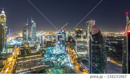 Skyline view of the buildings of Sheikh Zayed Road and DIFC night timelapse in Dubai, UAE. Skyline view of the buildings of Sheikh Zayed Road and DIFC night timelapse in Dubai, UAE. 138231667