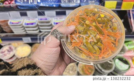 Close-up of sauerkraut, pickled carrots and pickles on display in a grocery store 138232232