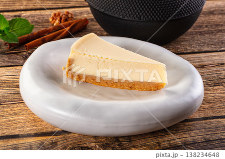 Classic delicous cheesecake slice served mint Classic delicous cheesecake slice served mint 138234648