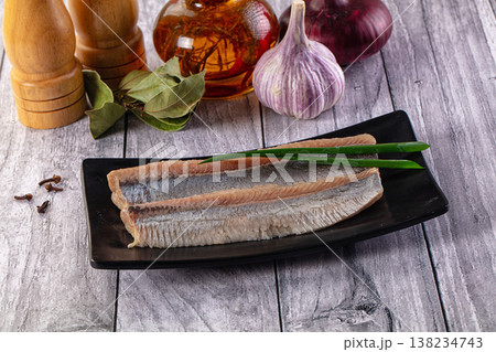 Marinated salted herring fillet slices Marinated salted herring fillet slices 138234743