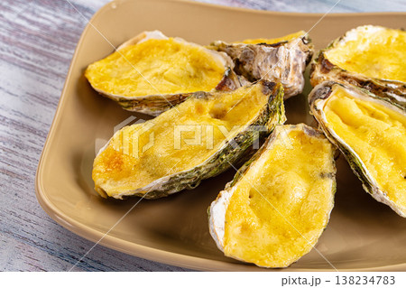 Baked oyster with parmesan cheese Baked oyster with parmesan cheese 138234783
