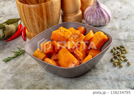 Vegan cuisine - baked pumpkin with herbs Vegan cuisine - baked pumpkin with herbs 138234795