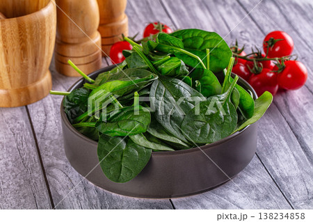 Green spinach leaves heap in the bowl 138234858