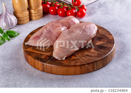 Fresh raw chicken breast over board Fresh raw chicken breast over board 138234864