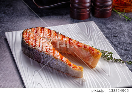 Grilled salmon steak served thyme 138234906