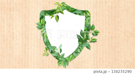 Horizontal paper background with shield made from green leaves. Safety, global ecological resource, go green concept. Environmental conservation, wildlife protection, Eco-friendly, Green energy 138235290