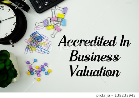 ABV Accredited in Business Valuation message with calculator, alarm clock and Stationery on white background ABV Accredited in Business Valuation message with calculator, alarm clock and Stationery on white background 138235945