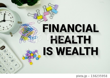 Financial Health Is Wealth message with calculator, alarm clock and Stationery on white background 138235958