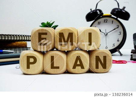 EMI Plan alphabet letters with calculator and alarm clock on white background 138236014