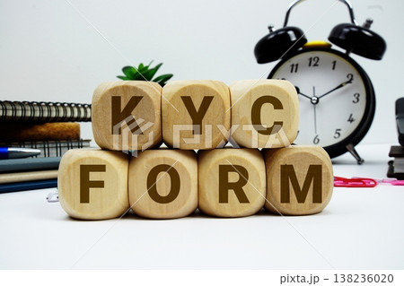 KYC Form alphabet letters with calculator and alarm clock on white background 138236020