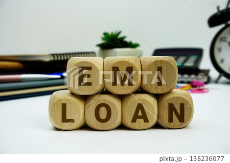 EMI Loan alphabet letters with calculator and alarm clock on white background EMI Loan alphabet letters with calculator and alarm clock on white background 138236077