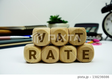 VAT Rate alphabet letters with calculator and alarm clock on white background VAT Rate alphabet letters with calculator and alarm clock on white background 138236086