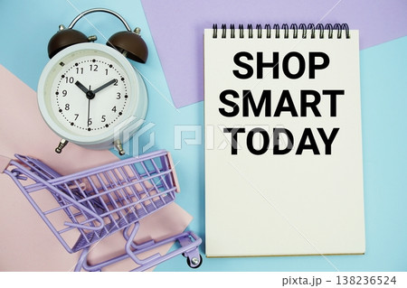 Shop Smart Today text written on notepad with alarm clock and trolley shopping cart Shop Smart Today text written on notepad with alarm clock and trolley shopping cart 138236524