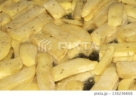 Thick cut steak chips seasoned on a tin foil cooking base Thick cut steak chips seasoned on a tin foil cooking base 138236608