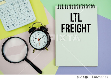 LTL Freight text with calculator, alarm clock and magnifying glass 138236855