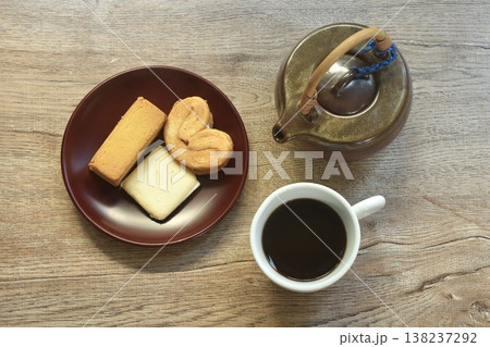 assorted sweet dessert pineapple pie and butterfly pie with black coffee cup on table  138237292