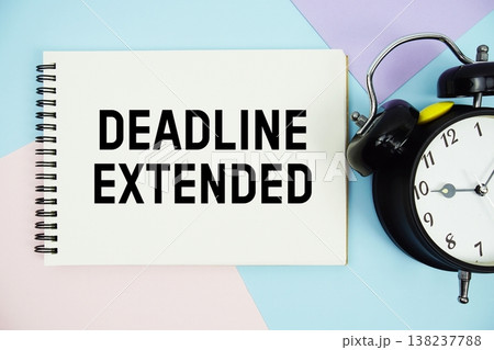 Deadline Extended text written on notepad with alarm clock flat lay on multicolor pastel background Deadline Extended text written on notepad with alarm clock flat lay on multicolor pastel background 138237788