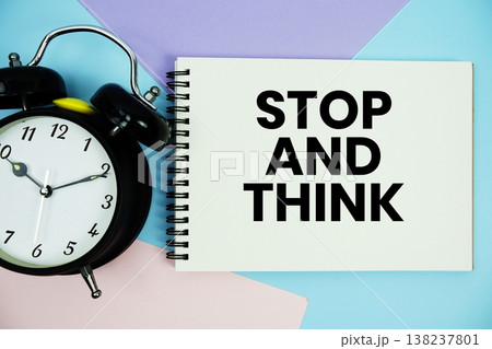 Stop and Think text written on notepad with alarm clock flat lay on multicolor pastel background Stop and Think text written on notepad with alarm clock flat lay on multicolor pastel background 138237801
