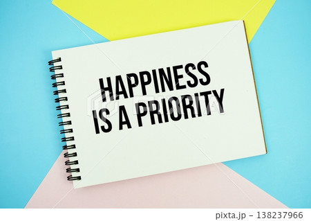 Happiness is a Priority text written on notepad flat lay on multicolor pastel background Happiness is a Priority text written on notepad flat lay on multicolor pastel background 138237966