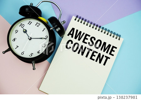 Awesome Content text written on notepad with alarm clock flat lay on multicolor pastel background 138237981