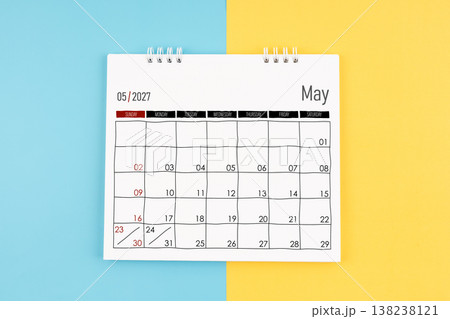 May 2027 calendar on blue and yellow background, Flat lay. May 2027 calendar on blue and yellow background, Flat lay. 138238121
