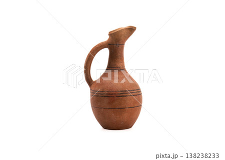 Terracotta jug with elegant curve and rustic texture Terracotta jug with elegant curve and rustic texture 138238233