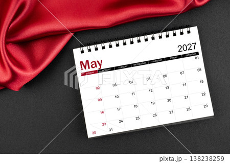 May 2027 Monthly desk calendar with red silk on black leather background. May 2027 Monthly desk calendar with red silk on black leather background. 138238259
