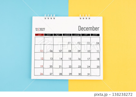 December 2027 calendar on blue and yellow background, Flat lay. December 2027 calendar on blue and yellow background, Flat lay. 138238272