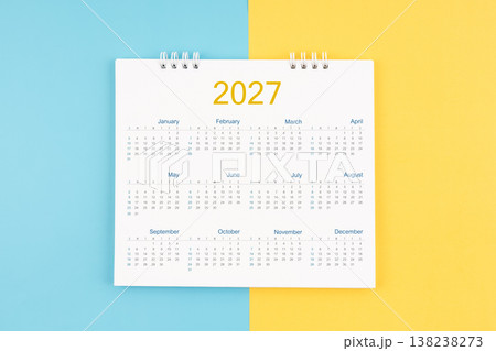Yearly calendar 2027 on blue and yellow background, Flat lay. 138238273