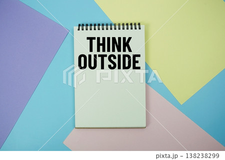 Think Outside text written on notepad flat lay on multicolor pastel background 138238299