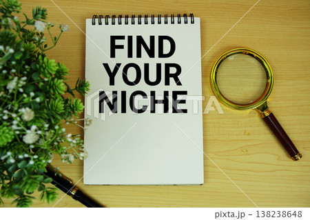 Find Your Niche text written on notepad with magnifying glass flat lay on wooden background Find Your Niche text written on notepad with magnifying glass flat lay on wooden background 138238648