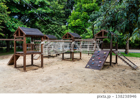 Rope bridge and climb ramp in summer camp playground 138238946
