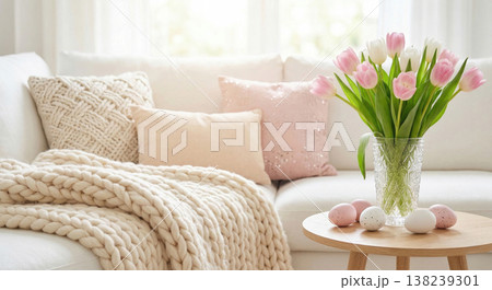 Cozy living room with white sofa, pink tulips, and Easter decor Cozy living room with white sofa, pink tulips, and Easter decor 138239301
