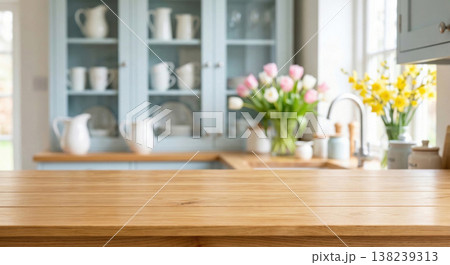 Blurred kitchen interior with wooden countertop and flowers Blurred kitchen interior with wooden countertop and flowers 138239313