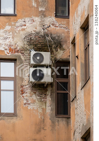 air conditioning on facade of building, air cooling in hot weather. air conditioning on facade of building, air cooling in hot weather. 138240064