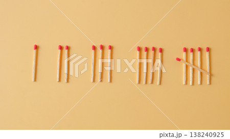 Pile of red head matchsticks on color background. Pile of red head matchsticks on color background. 138240925