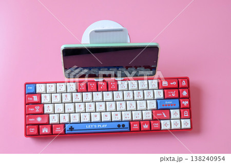 computer keyboard with mobile phone for gamer. 138240954
