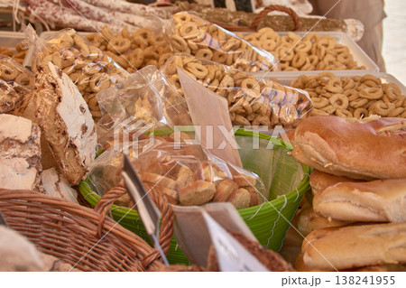 A variety of artisanal baked goods displayed at a colorful traditional market stall in Aix, Provence, France A variety of artisanal baked goods displayed at a colorful traditional market stall in Aix, Provence, France 138241955