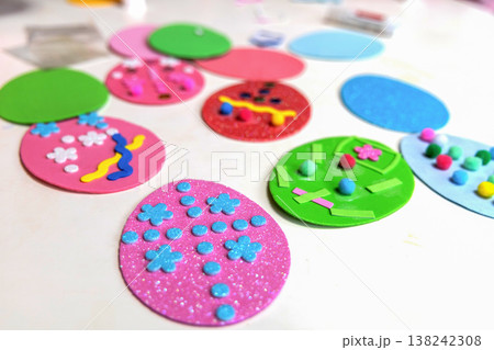 Flat lay of easter craft supplies for kids sensory play and education Flat lay of easter craft supplies for kids sensory play and education 138242308