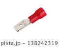 Red insulated metal spade terminal connector on white background 138242319