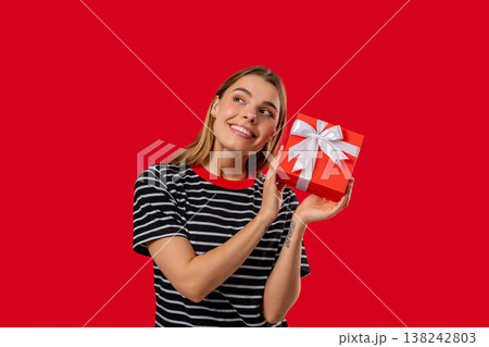 Happy Grateful Woman With Gift Box On Red Wall. Lady Smiling, Present, Surprise 138242803
