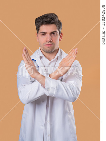 Serious Doctor Man Showing No Crossing Hands Sign, Rejecting Gesture,Stop Palms Serious Doctor Man Showing No Crossing Hands Sign, Rejecting Gesture,Stop Palms 138242838