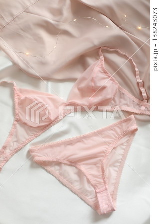 Woman's lingerie on the bed sheets. Lace sexy female underwear. Beauty, fashion blogger concept. Female bra, panties, erotic clothes. Lingerie advertising Woman's lingerie on the bed sheets. Lace sexy female underwear. Beauty, fashion blogger concept. Female bra, panties, erotic clothes. Lingerie advertising 138243073