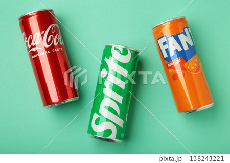 Mykolaiv, Ukraine - March 25, 2026: Iron cans of Coca Cola, Fanta and Sprite drink on mint background. Mykolaiv, Ukraine - March 25, 2026: Iron cans of Coca Cola, Fanta and Sprite drink on mint background. 138243221