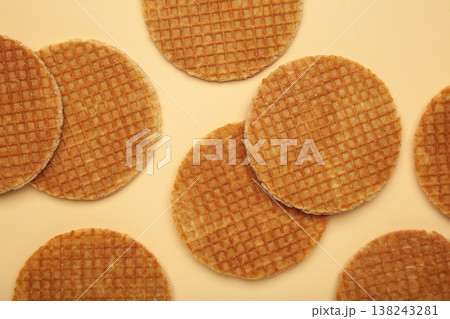 Dutch stroopwafel cookies or caramel waffles on beige background. Dutch stroopwafel cookies or caramel waffles on beige background. 138243281