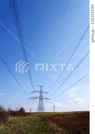 Electricity pylons conducting current from distribution power station, blackout and grid stability concept, copy space Electricity pylons conducting current from distribution power station, blackout and grid stability concept, copy space 138243599