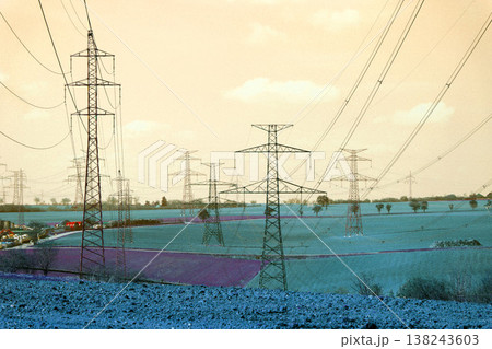 Electricity pylons conducting current from distribution power station, blackout and grid stability concept, copy space 138243603