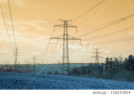 Electricity pylons conducting current from distribution power station, blackout and grid stability concept, copy space Electricity pylons conducting current from distribution power station, blackout and grid stability concept, copy space 138243604