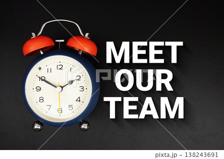 Meet Our Team text with alarm clock on black background Meet Our Team text with alarm clock on black background 138243691