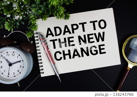Adapt To The New Change text with alarm clock and magnifying glass Adapt To The New Change text with alarm clock and magnifying glass 138243766